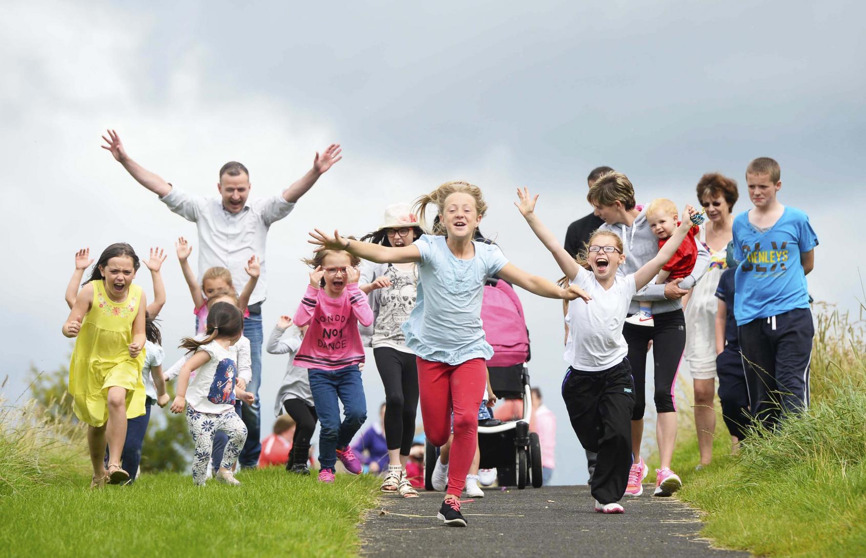 Children running at The Cornfield Project